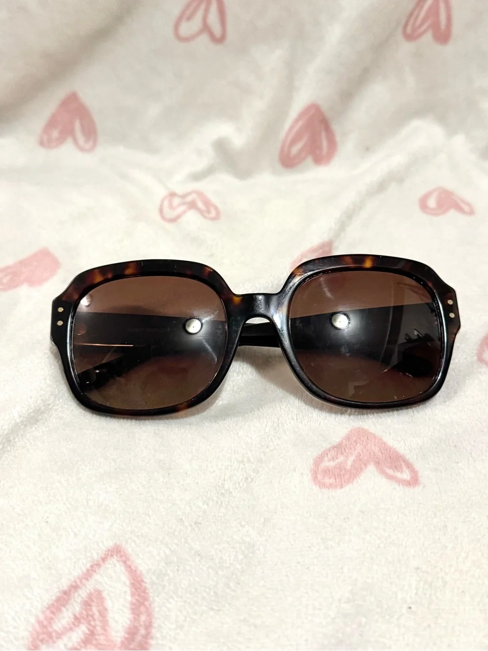 Tory Burch sunglasses with a tortoiseshell pattern